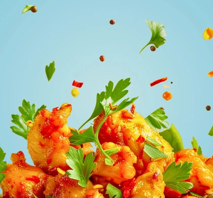 Image de couverture montrant du poulet cuit avec un mélange d'épices par dessus